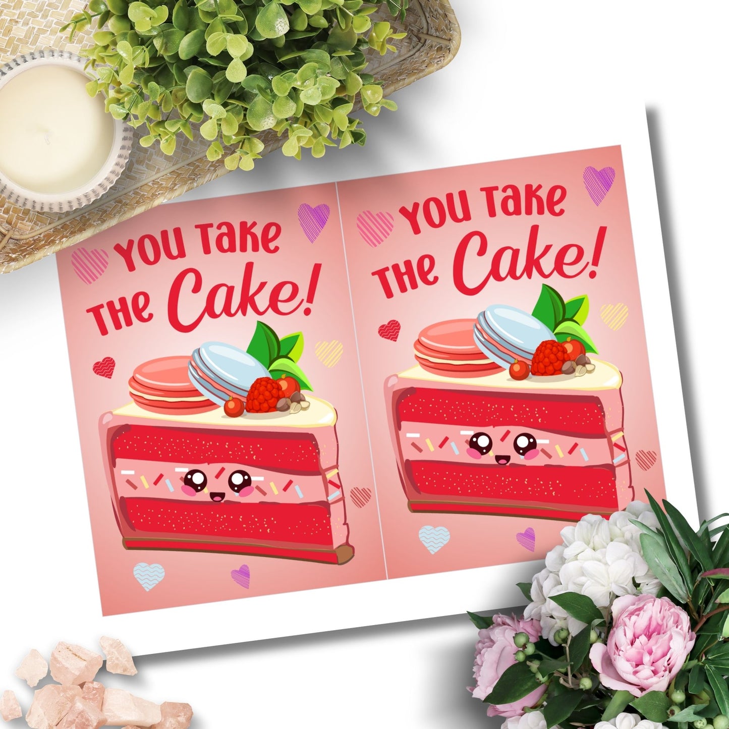 Printable Valentine’s Day card featuring the phrase “You Take the Cake” with a charming dessert design. Designed as a 5x7 PDF on an 8.5 x 11 sheet with two cards per page. A sweet and punny Valentine’s card for loved ones.