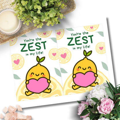 Printable Valentine’s Day Greeting Card featuring the phrase “You’re the Zest in My Life” with a lemon theme. Designed as a 5x7 PDF on an 8.5 x 11 sheet with two cards per page. A fun and punny Valentine’s card for loved ones.