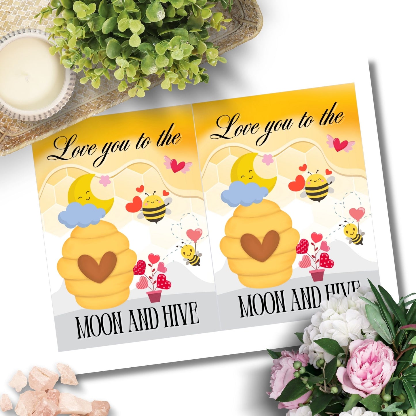 Printable Valentine’s Day card featuring the phrase “Love You to the Moon and Hive” with a bee and moon design. Designed as a 5x7 PDF on an 8.5 x 11 sheet with two cards per page. A punny and heartfelt Valentine’s card for loved ones.