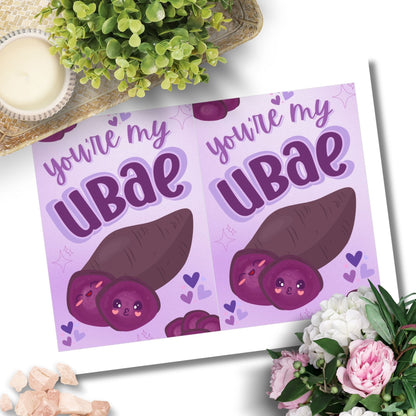 Printable Valentine’s Day card featuring the phrase “You’re My UBAE” with a cute and colorful ube-themed design. Designed as a 5x7 PDF on an 8.5 x 11 sheet with two cards per page. A punny and heartfelt Valentine’s card for ube lovers.
