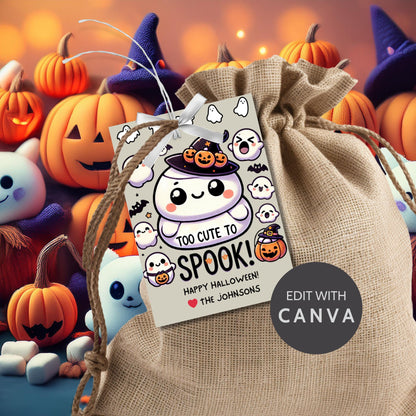 Cute Halloween gift tags featuring a squishy ghost in a witch hat, surrounded by ghosts and pumpkins. The tag reads "Too Cute to Spook!" and is perfect for Squishmallow-themed Halloween gifts. The tags are 2.5 x 3.5 inches and come with a printable PDF and an editable template.