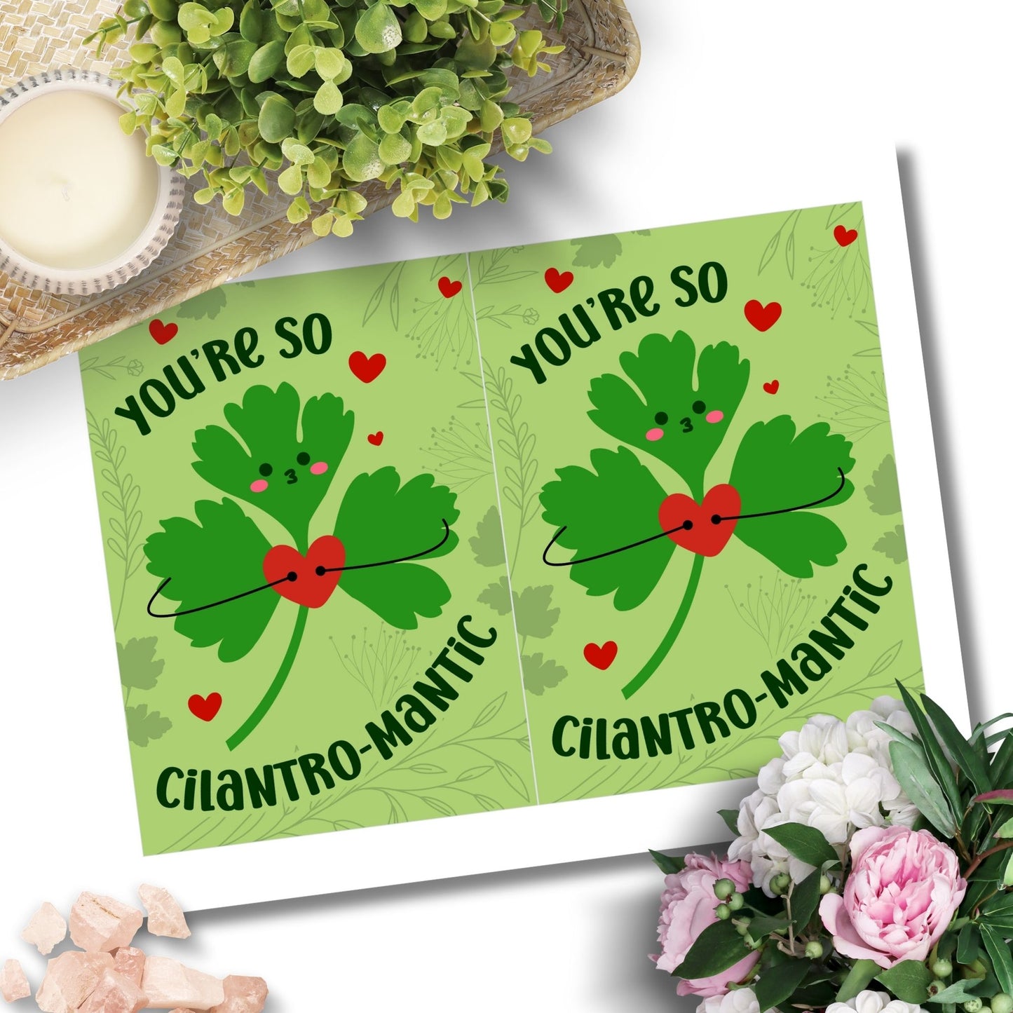 Printable Valentine’s Day Greeting Card featuring the phrase “You’re So Cilantromantic” with a playful cilantro design. Designed as a 5x7 PDF on an 8.5 x 11 sheet with two cards per page. A punny and romantic Valentine’s card for loved ones.