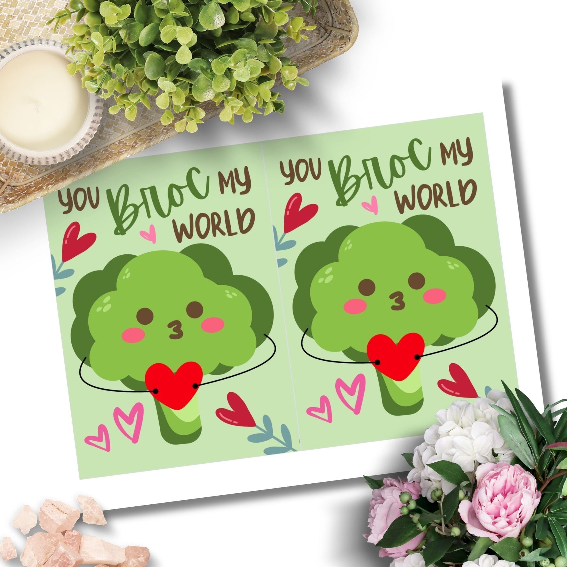 Printable Valentine’s Day Greeting Card featuring the phrase “You Broc My World” with a fun broccoli design. Designed as a 5x7 PDF on an 8.5 x 11 sheet with two cards per page. A punny and veggie-themed Valentine’s card for loved ones.