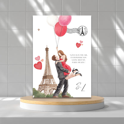 Romantic Paris-themed engagement invitation featuring watercolor Eiffel Tower, couple with heart balloons, and editable text; coordinates with matching 24x36 welcome poster.