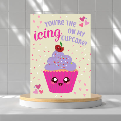 Printable Valentine’s Day card featuring the phrase “You’re the Icing on My Cupcake” with a cute cupcake design. Designed as a 5x7 PDF on an 8.5 x 11 sheet with two cards per page. A punny and sweet Valentine’s card for loved ones.