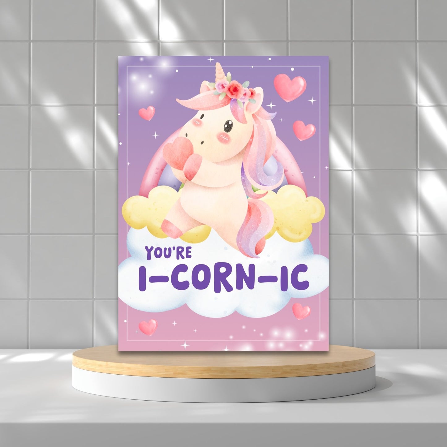 Printable Valentine’s Day Greeting Card featuring the unicorn-inspired pun “You're iCORNic.” Designed as a 5x7 PDF on an 8.5 x 11 sheet with two cards per page. A cute and whimsical Valentine’s card for unicorn lovers.