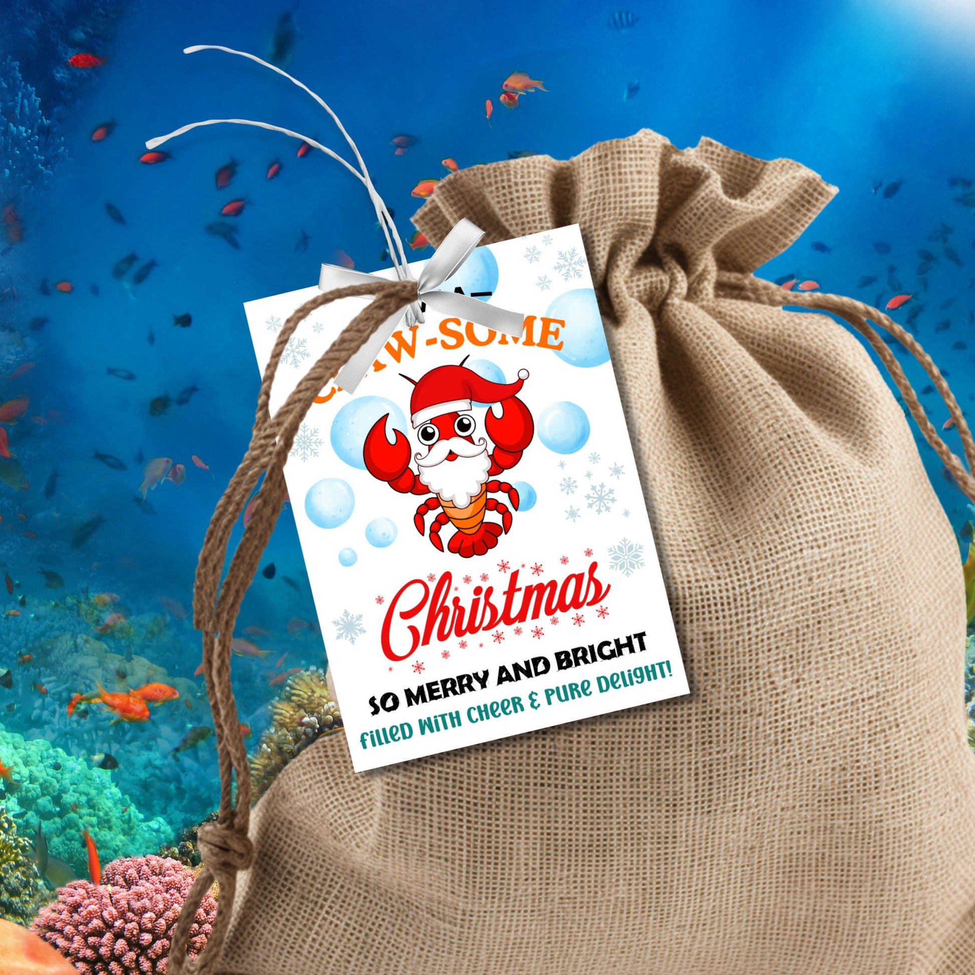 Lobster-themed Christmas gift tags featuring a bright red lobster in a Santa hat surrounded by bubbles and snowflakes, with the cheerful message 'Have a Claw-some Christmas. So Merry and Bright, Filled with Cheer & Pure Delight!' Perfect for adding a coastal charm to holiday gifts.