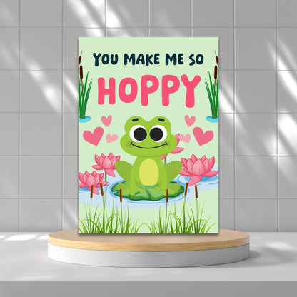 Printable Valentine’s Day Greeting Card featuring the pun “You Make Me So Hoppy.” Designed as a 5x7 PDF on an 8.5 x 11 sheet with two cards per page. A fun and cute Valentine’s card for frog lovers.