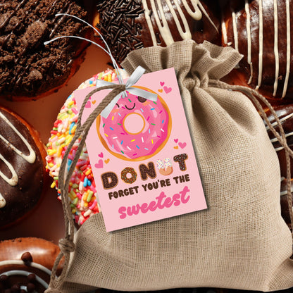 Cute printable and editable donut-themed Valentine’s Day gift tags featuring the message "Donut Forget You’re the Sweetest!" Perfect for pairing with a donut or treat for teachers, employees, students, and coworkers.