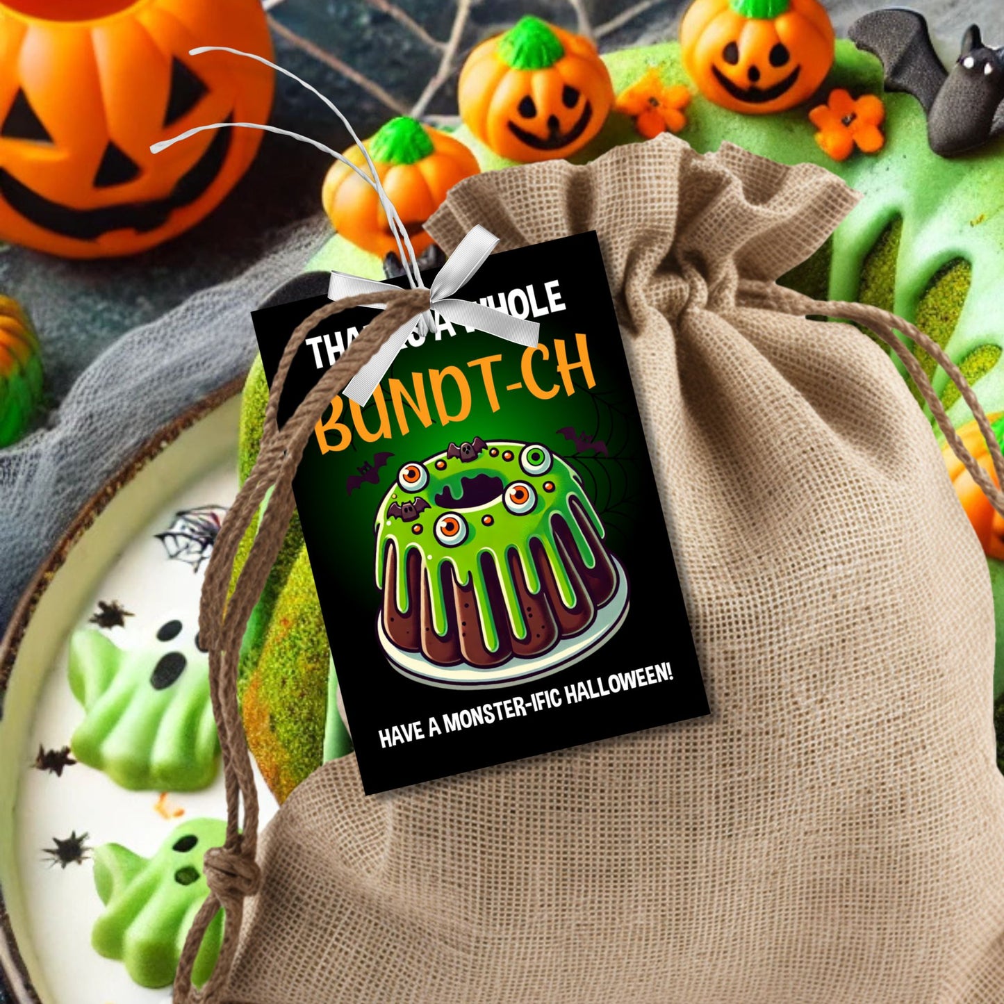 Halloween gift tag featuring a monster-themed bundt cake with green icing, creepy eyeballs, and the message 'Thanks a Whole Bundt-Ch. Have a Monster-ific Halloween!'