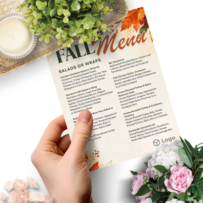 Editable Fall Menu Template featuring warm autumn leaves, seasonal watercolor accents, customizable menu text, café name, and logo placeholder.
