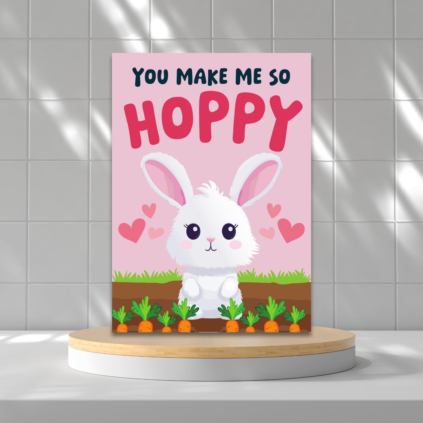 Printable Valentine’s Day Greeting Card featuring the pun “You Make Me So Hoppy.” Designed as a 5x7 PDF on an 8.5 x 11 sheet with two cards per page. A fun and cute Valentine’s card for bunny lovers.