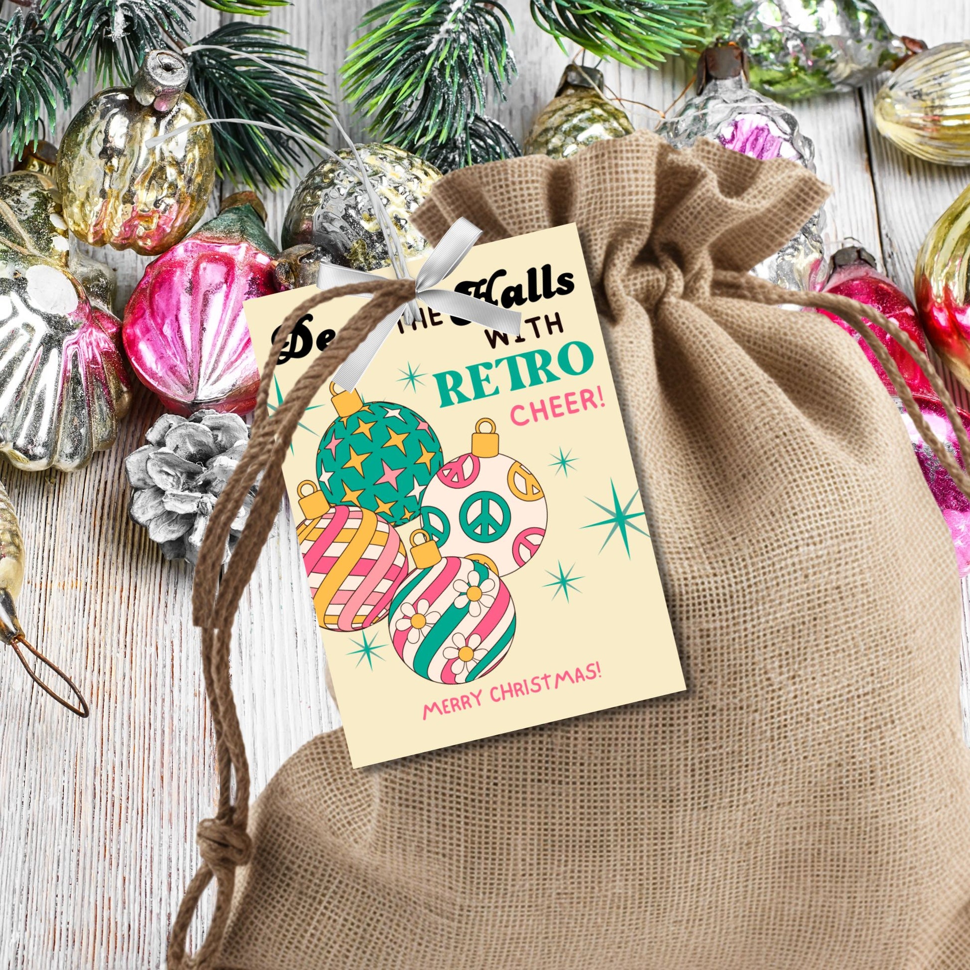 Retro-inspired Christmas gift tags featuring colorful ornaments with peace signs and stripes, paired with the message "Deck the Halls with Retro Cheer!" These printable and editable tags add a cheerful, nostalgic touch to holiday gifts.