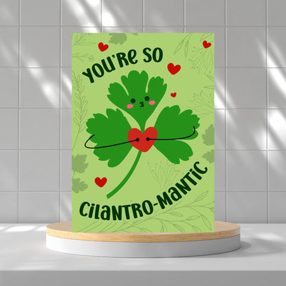 Printable Valentine’s Day Greeting Card featuring the phrase “You’re So Cilantromantic” with a playful cilantro design. Designed as a 5x7 PDF on an 8.5 x 11 sheet with two cards per page. A punny and romantic Valentine’s card for loved ones.