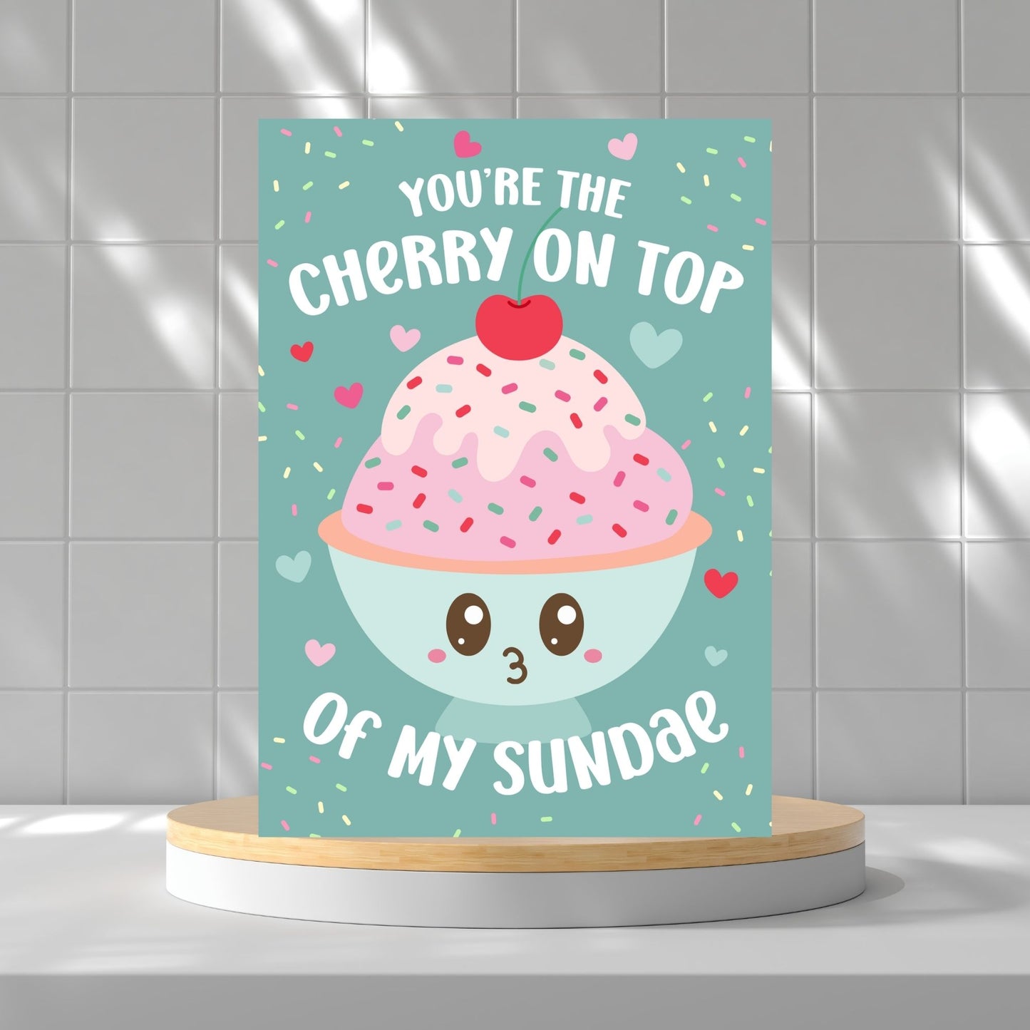 Printable Valentine’s Day card featuring the phrase “You’re the Cherry on Top of My Sundae” with a cute ice cream sundae design. Designed as a 5x7 PDF on an 8.5 x 11 sheet with two cards per page. A punny and heartfelt Valentine’s card for loved ones.