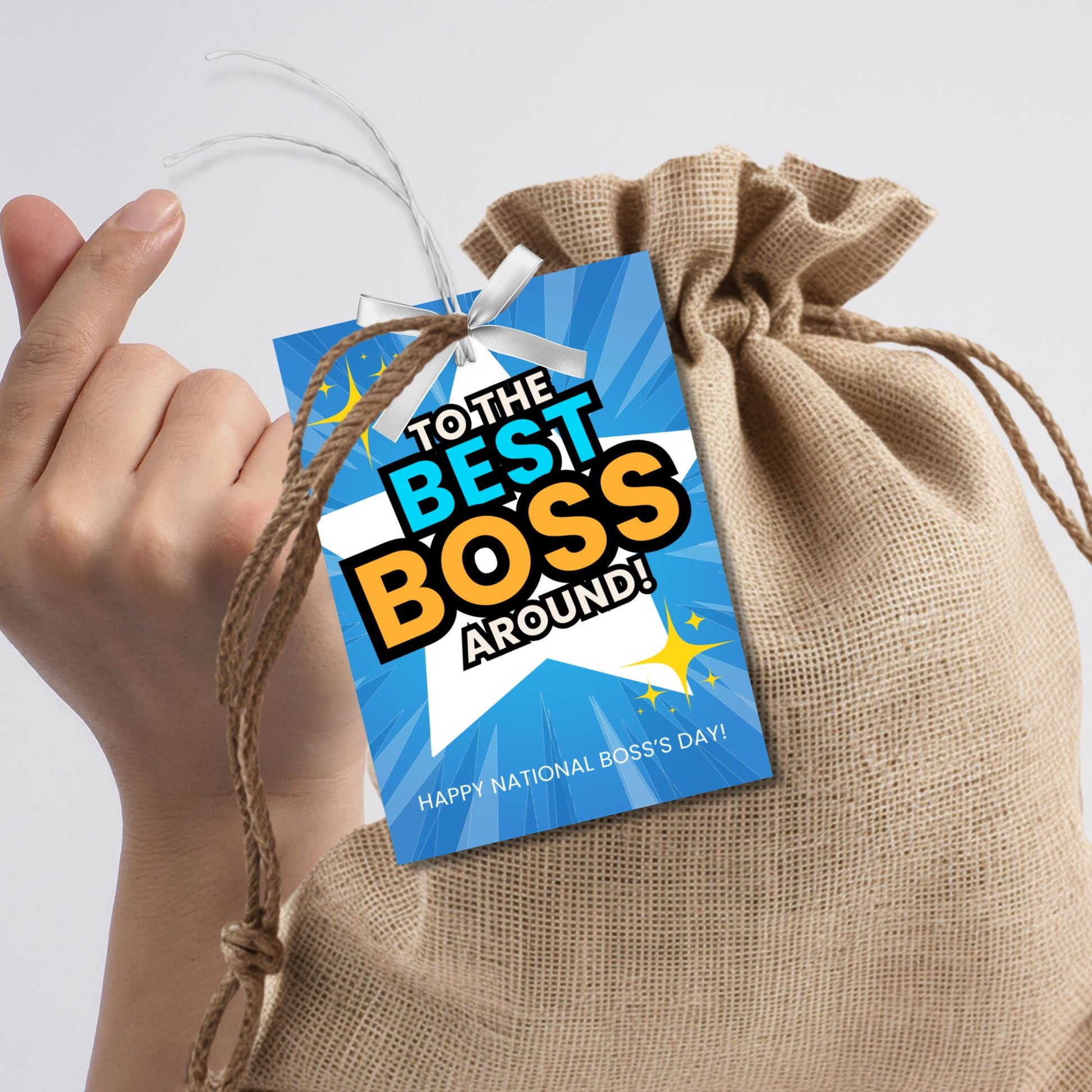 Editable National Boss's Day gift tags with the bold message "To the Best Boss Around!" against a bright blue and starburst background. Each tag is 2.5 x 3.5 inches, 8 per sheet.