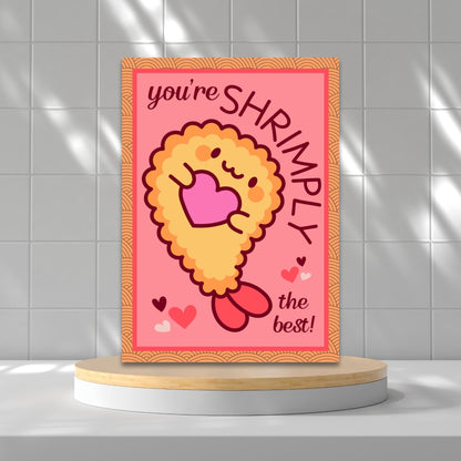 Printable Valentine’s Day Greeting Card featuring the pun “You're Shrimply the Best.” Designed as a 5x7 PDF on an 8.5 x 11 sheet with two cards per page. A fun and punny Valentine’s card for seafood lovers and friends.