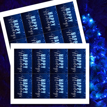 Printable blue Holiday gift tags with a glittery blue background and bold light blue "Happy Holidays" text, sized 2.5 x 3.5 inches, 8 tags per sheet.