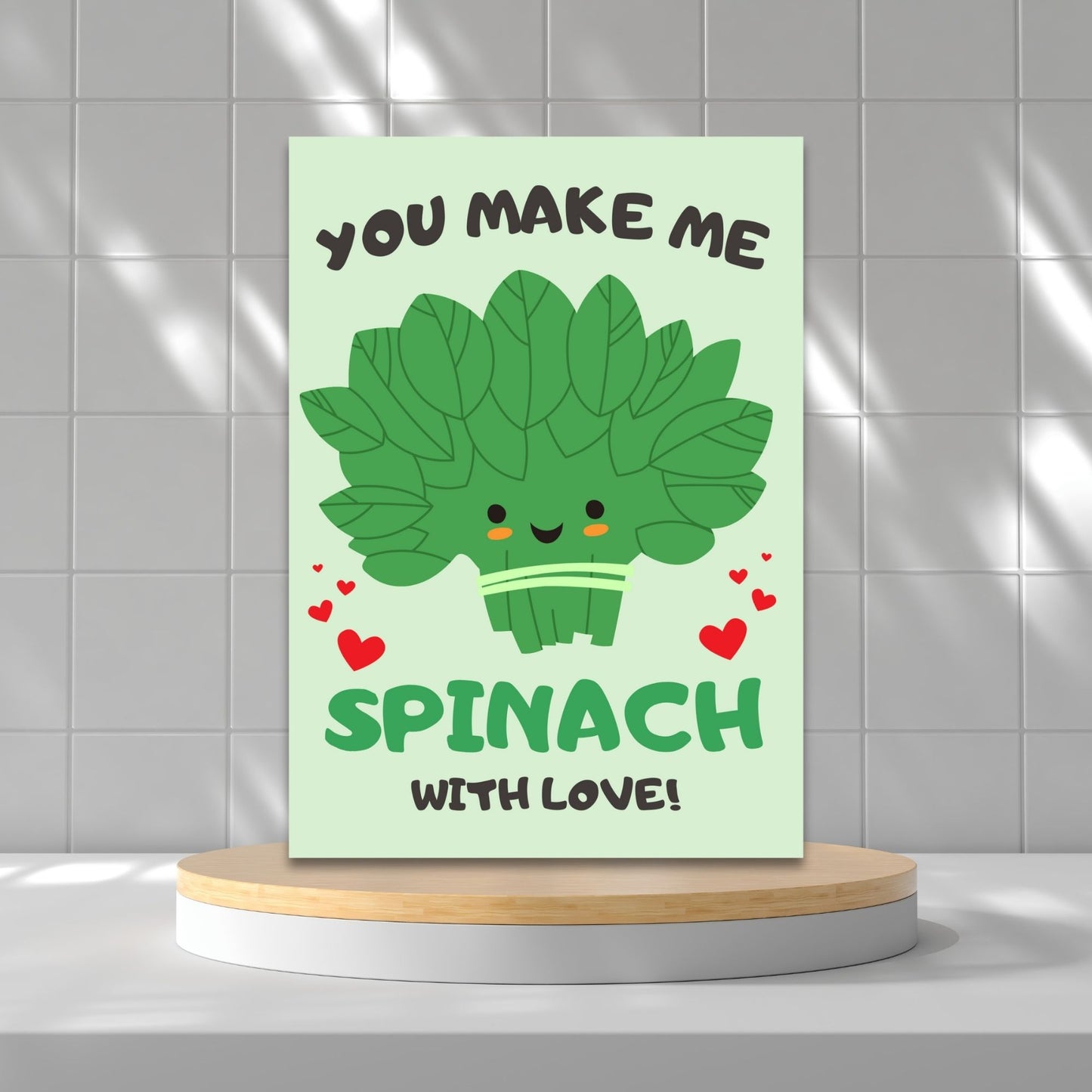 Printable Valentine’s Day Greeting Card featuring the phrase “You Make Me Spinach with Love” with a fun spinach design. Designed as a 5x7 PDF on an 8.5 x 11 sheet with two cards per page. A punny and fresh Valentine’s card for loved ones.