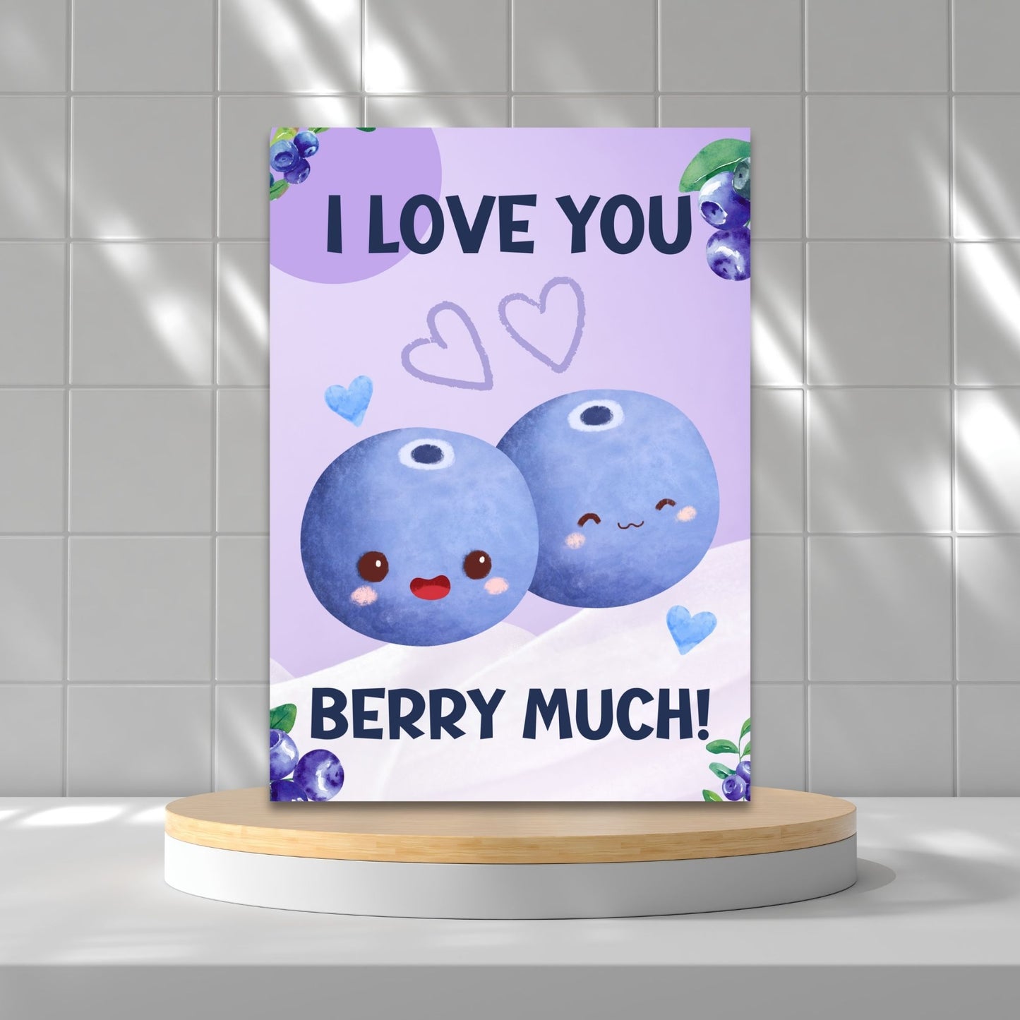 Printable Valentine’s Day Greeting Card featuring the phrase “I Love You Berry Much” with a blueberry theme. Designed as a 5x7 PDF on an 8.5 x 11 sheet with two cards per page. A sweet and punny Valentine’s card for loved ones.