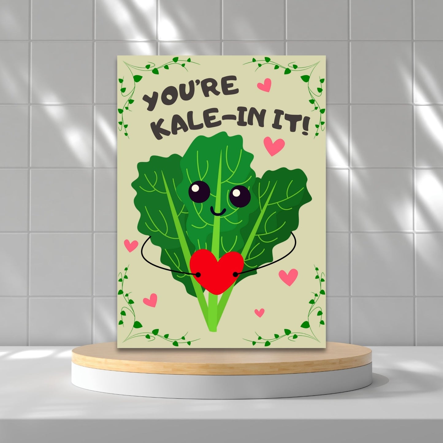 Printable Valentine’s Day Greeting Card featuring the phrase “You’re Kalein’ It” with a cute kale illustration. Designed as a 5x7 PDF on an 8.5 x 11 sheet with two cards per page. A punny and fresh Valentine’s card for loved ones.