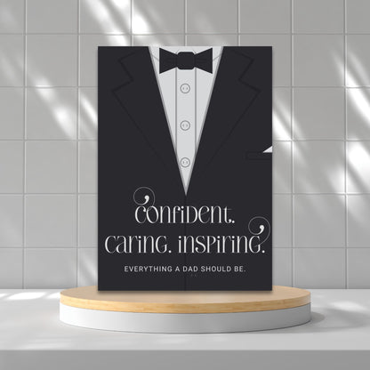 Father's Day card printable with bold text 'Confident. Caring. Inspiring.' featuring a minimalist design of a suit and tie in grayscale tones.