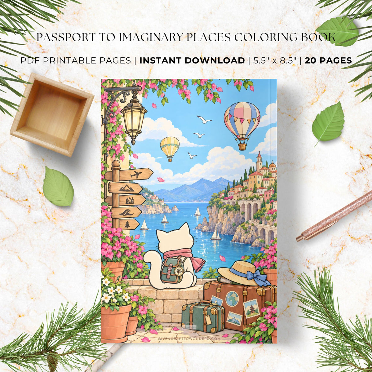 A colorful illustrated coloring book cover titled 'Passport to Imaginary Places Coloring Book' is shown as a product mockup on a marble surface with decorative leaves, pine branches, a wooden tray, and a pencil. The cover art features a white cat with a backpack looking out over a coastal town, hot air balloons, mountains, and blue water.