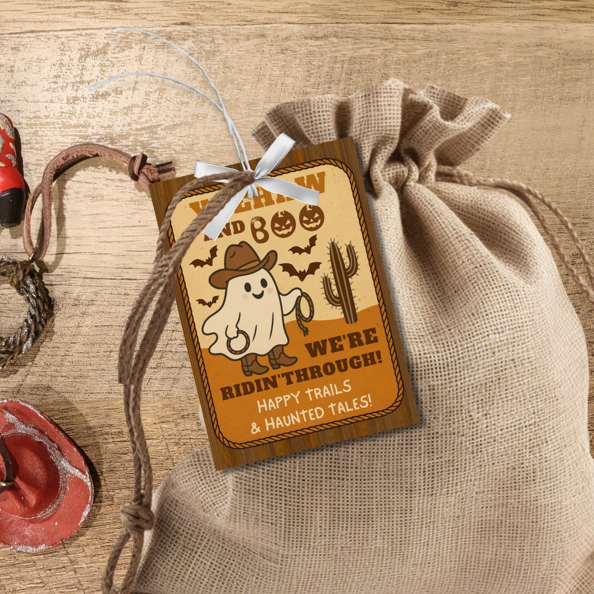 Halloween-themed gift tag with ghost and cowboy hat design on a rustic background.