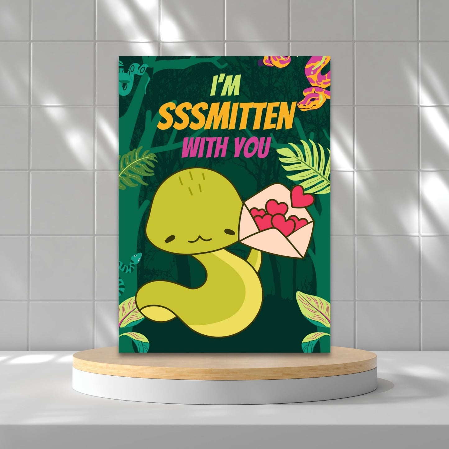 Printable Valentine’s Day Greeting Card featuring the phrase “I'm Sssmitten With You” with a snake theme. Designed as a 5x7 PDF on an 8.5 x 11 sheet with two cards per page. A playful and unique Valentine’s card for snake lovers.