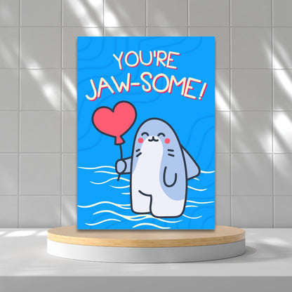 Printable Valentine’s Day Greeting Card featuring the phrase “You’re Jawsome” with a shark theme. Designed as a 5x7 PDF on an 8.5 x 11 sheet with two cards per page. A fun and unique Valentine’s card for shark lovers.