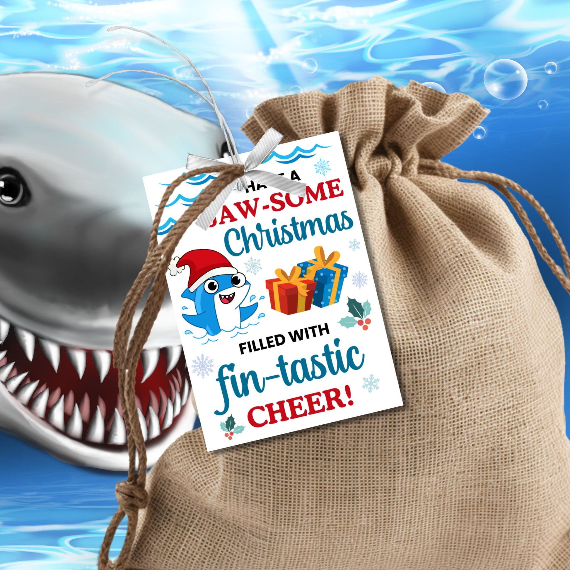 Festive shark-themed holiday gift tags featuring a smiling shark wearing a Santa hat, surrounded by waves, holly, and presents, with the message 'Have a JAW-some Christmas filled with fin-tastic cheer!' Perfect for personalized Christmas gifts.