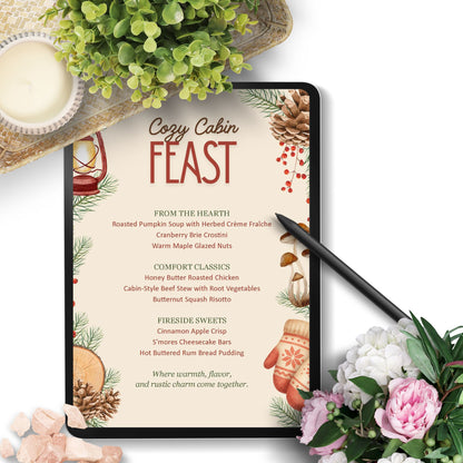 Menu for 'Cozy Cabin Feast' with festive design elements on a tablet, surrounded by flowers and a candle.