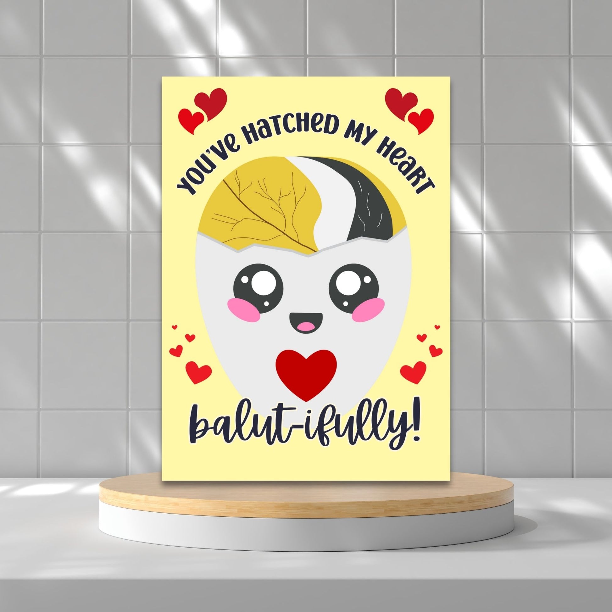 Printable Valentine’s Day card featuring the phrase “You’ve Hatched My Heart Balutifully” with a fun and unique balut (Filipino delicacy) design. Designed as a 5x7 PDF on an 8.5 x 11 sheet with two cards per page. A punny and heartfelt Valentine’s card for Filipino food lovers.