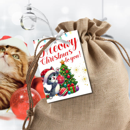 Christmas gift tags featuring a cute kitten in a Santa hat with a festive tree and gifts, paired with the message "Meowy Christmas to you!" These printable and editable tags add a playful, festive touch to holiday gifts for cat lovers.