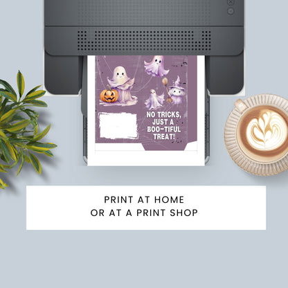 Halloween-themed card with ghosts and pumpkins being printed on a printer, with a cup of coffee and plant in the background.