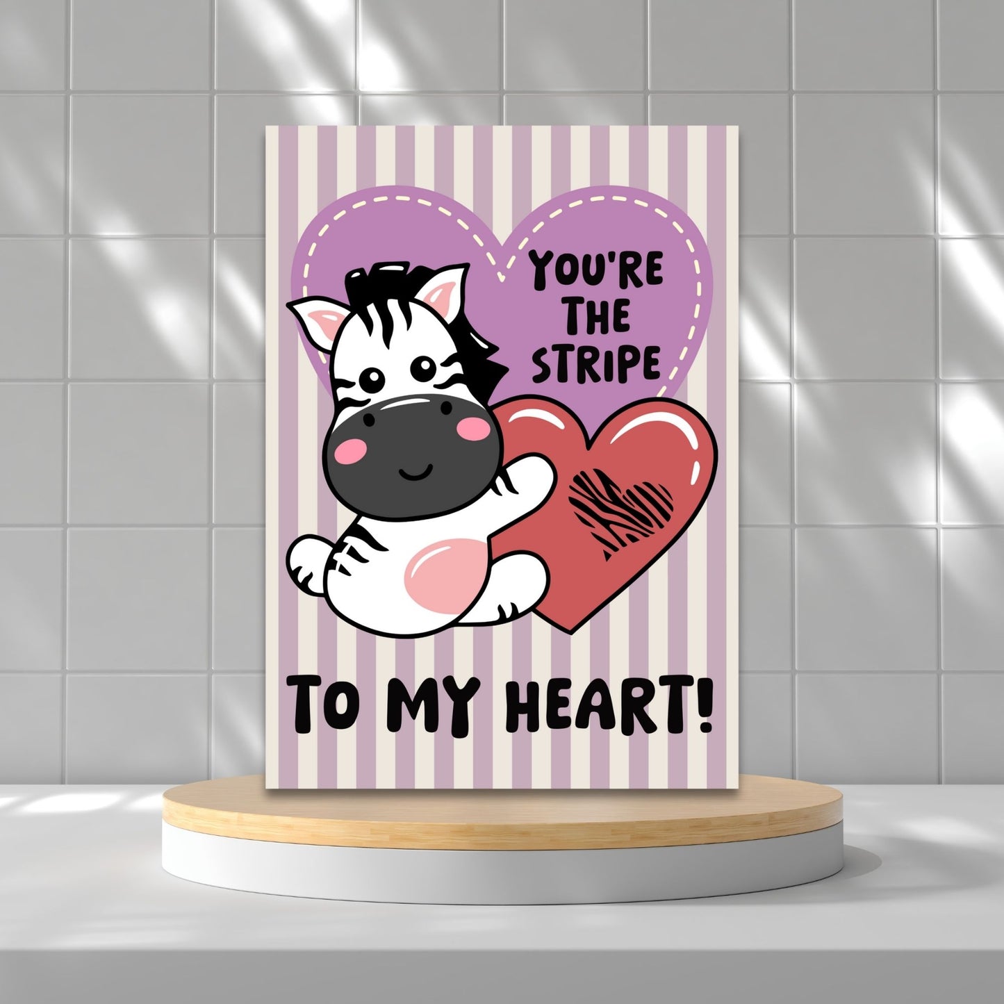 Printable Valentine’s Day Greeting Card featuring the phrase “You’re the Stripe to My Heart” with a zebra design. Designed as a 5x7 PDF on an 8.5 x 11 sheet with two cards per page. A cute and heartfelt Valentine’s card for zebra lovers.