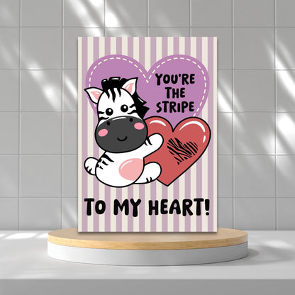 Printable Valentine’s Day Greeting Card featuring the phrase “You’re the Stripe to My Heart” with a zebra design. Designed as a 5x7 PDF on an 8.5 x 11 sheet with two cards per page. A cute and heartfelt Valentine’s card for zebra lovers.