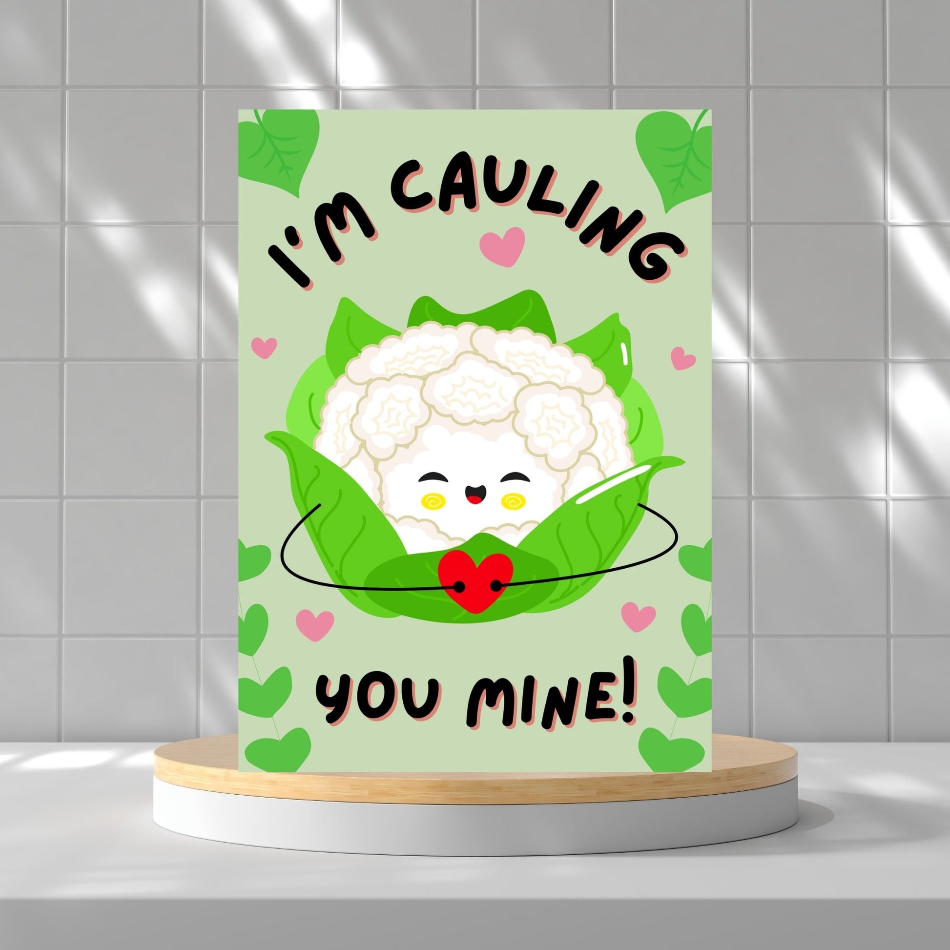 Printable Valentine’s Day Greeting Card featuring the phrase “I’m Cauling You Mine” with a cute cauliflower design. Designed as a 5x7 PDF on an 8.5 x 11 sheet with two cards per page. A fun and punny Valentine’s card for loved ones.