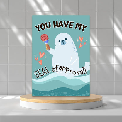 Printable Valentine’s Day Greeting Card featuring the phrase “You Have My Seal of Approval” with a seal theme. Designed as a 5x7 PDF on an 8.5 x 11 sheet with two cards per page. A cute and playful Valentine’s card for animal lovers.