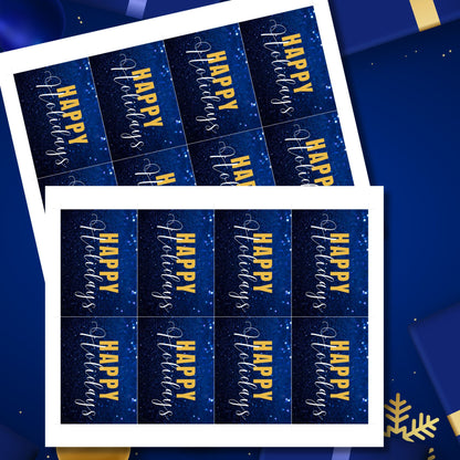 Printable blue and gold Holiday gift tags featuring a sparkling blue glitter background and bold gold "Happy Holidays" text, sized 2.5 x 3.5 inches, 8 per sheet.