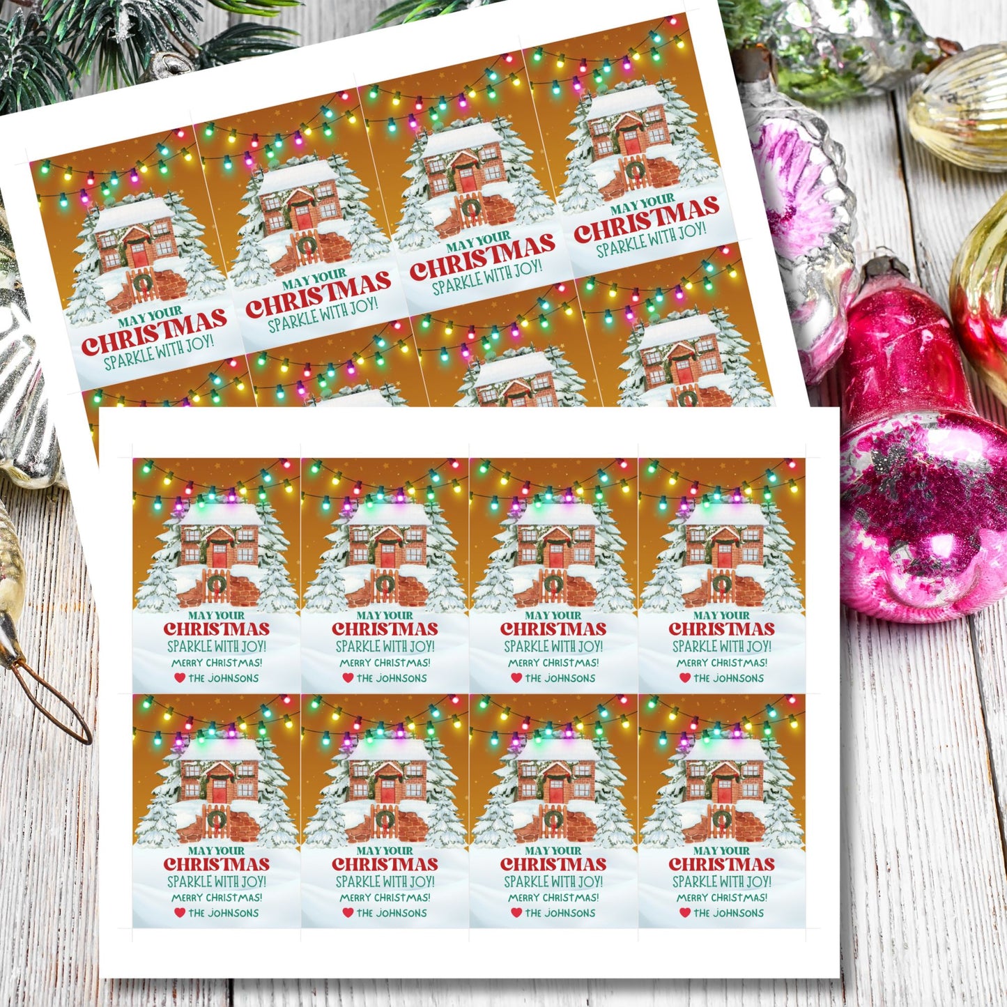 Christmas gift tags featuring a cozy snow-covered house decorated with festive lights, paired with the message "May Your Christmas Sparkle with Joy!" These printable and editable tags add a warm and festive touch to holiday gifts.