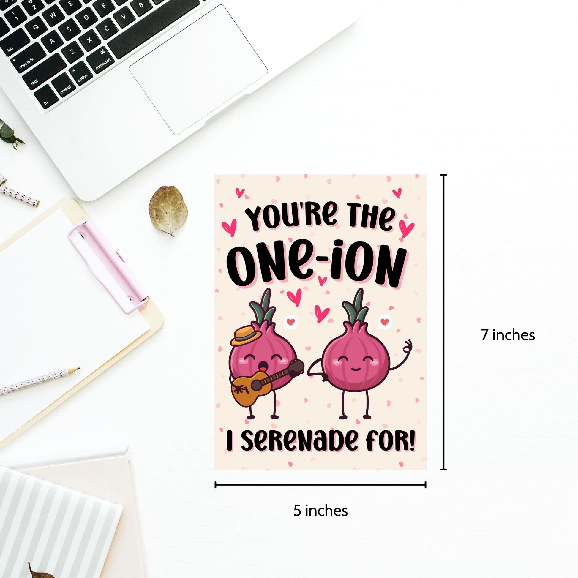 Printable Valentine’s Day Greeting Card featuring the phrase “You’re the One-ion a Serenade For” with a playful onion illustration. Designed as a 5x7 PDF on an 8.5 x 11 sheet with two cards per page. A punny and charming Valentine’s card for loved ones.