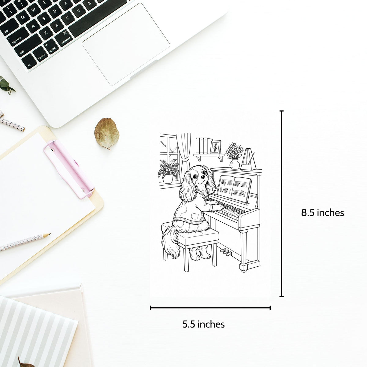 A black-and-white line-art print of a dog sitting at a piano, shown on a white desk with measurement labels indicating 8.5 inches tall by 5.