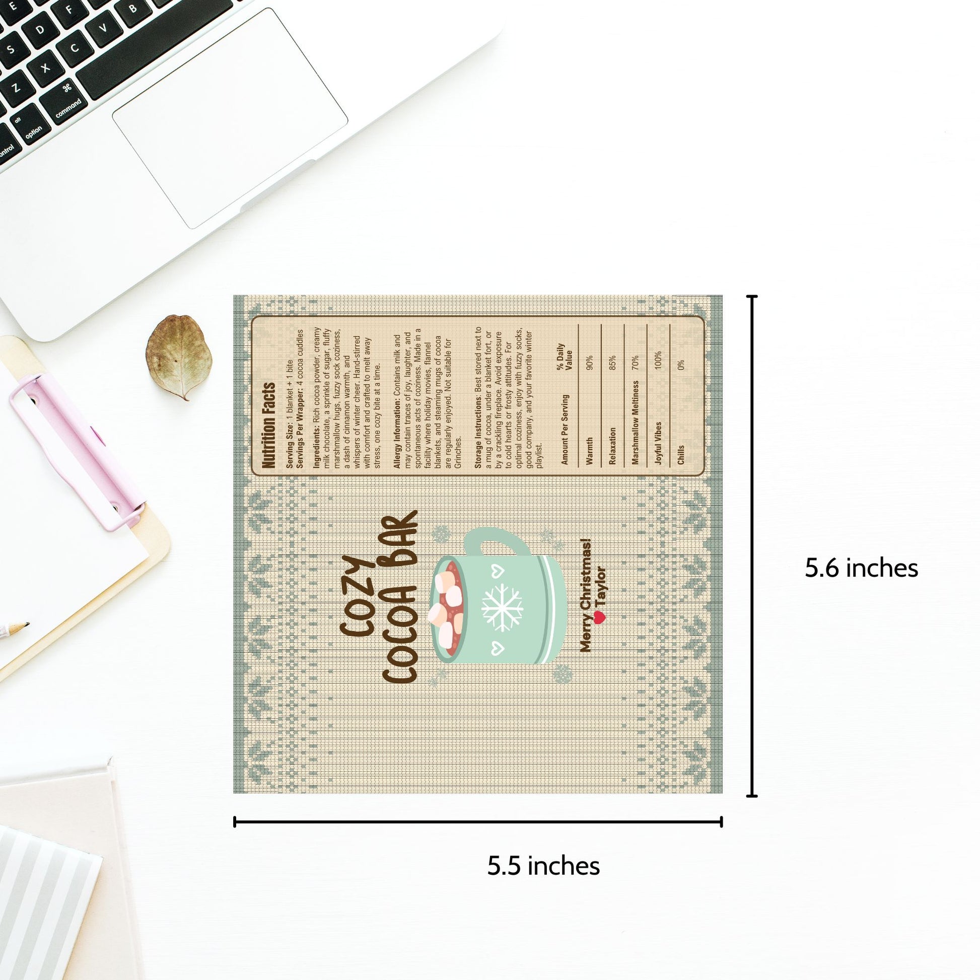 Measurement chart of a decorative mat with text and graphics, placed on a desk with stationery items.