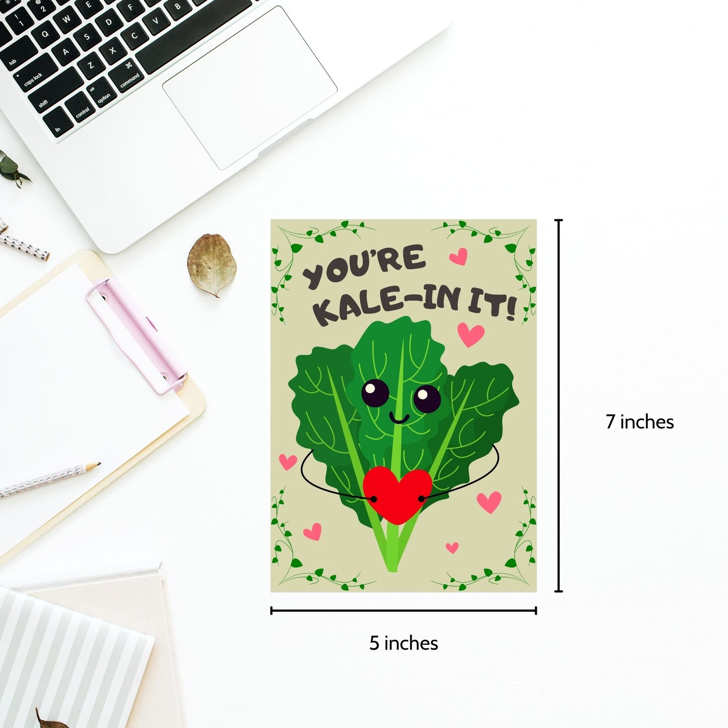 Printable Valentine’s Day Greeting Card featuring the phrase “You’re Kalein’ It” with a cute kale illustration. Designed as a 5x7 PDF on an 8.5 x 11 sheet with two cards per page. A punny and fresh Valentine’s card for loved ones.