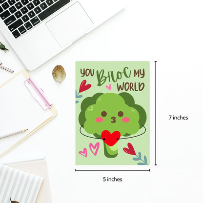 Printable Valentine’s Day Greeting Card featuring the phrase “You Broc My World” with a fun broccoli design. Designed as a 5x7 PDF on an 8.5 x 11 sheet with two cards per page. A punny and veggie-themed Valentine’s card for loved ones.