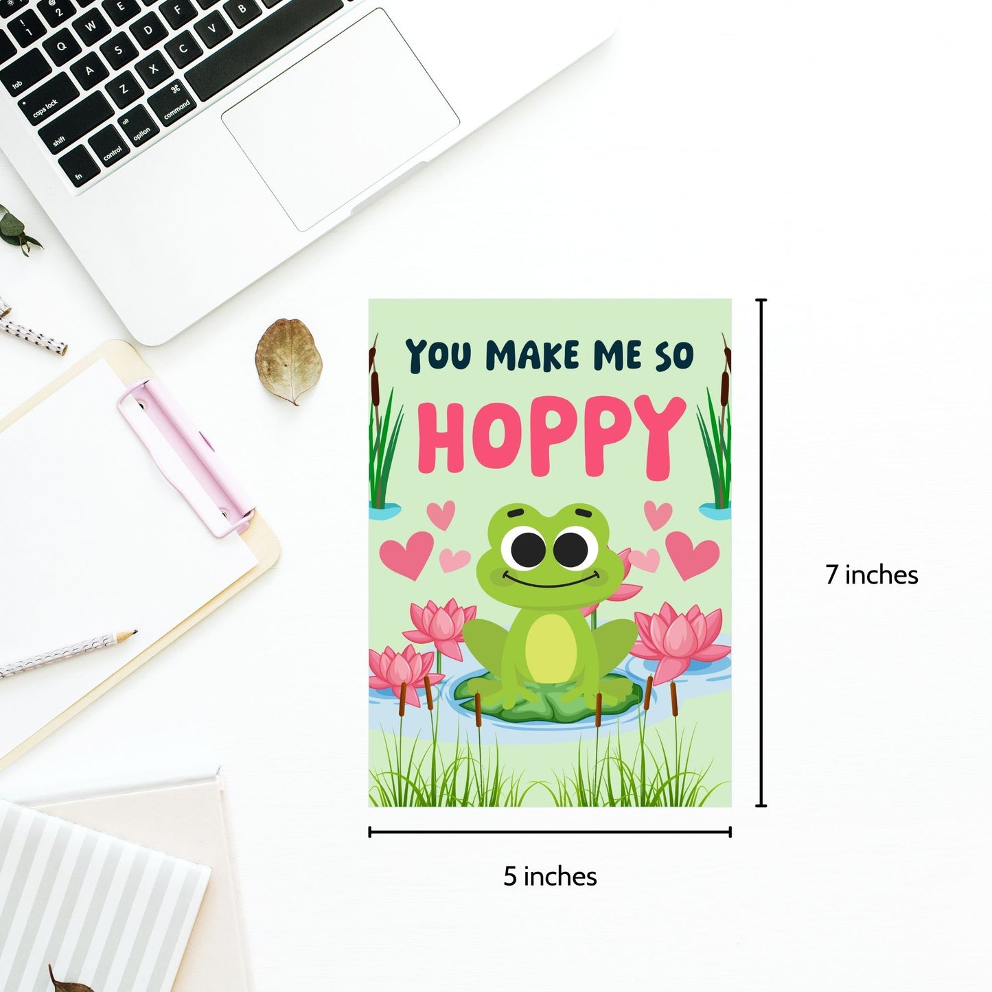 Printable Valentine’s Day Greeting Card featuring the pun “You Make Me So Hoppy.” Designed as a 5x7 PDF on an 8.5 x 11 sheet with two cards per page. A fun and cute Valentine’s card for frog lovers.