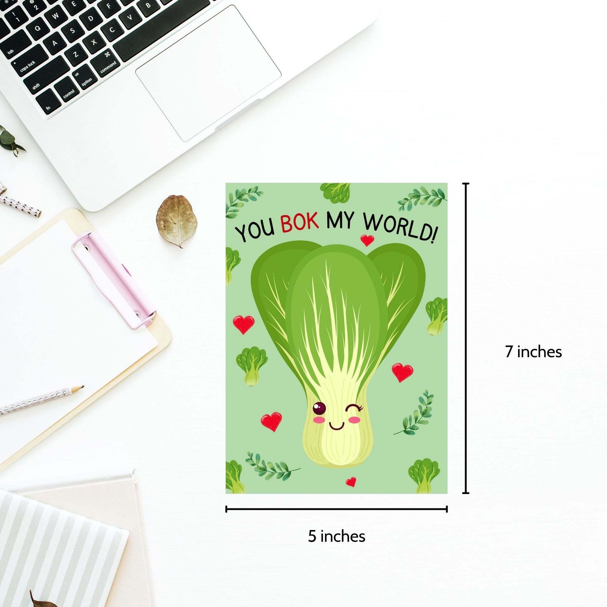 Printable Valentine’s Day Greeting Card featuring the phrase “You Bok My World” with a fun bok choy illustration. Designed as a 5x7 PDF on an 8.5 x 11 sheet with two cards per page. A cute and punny Valentine’s card for veggie lovers and friends.