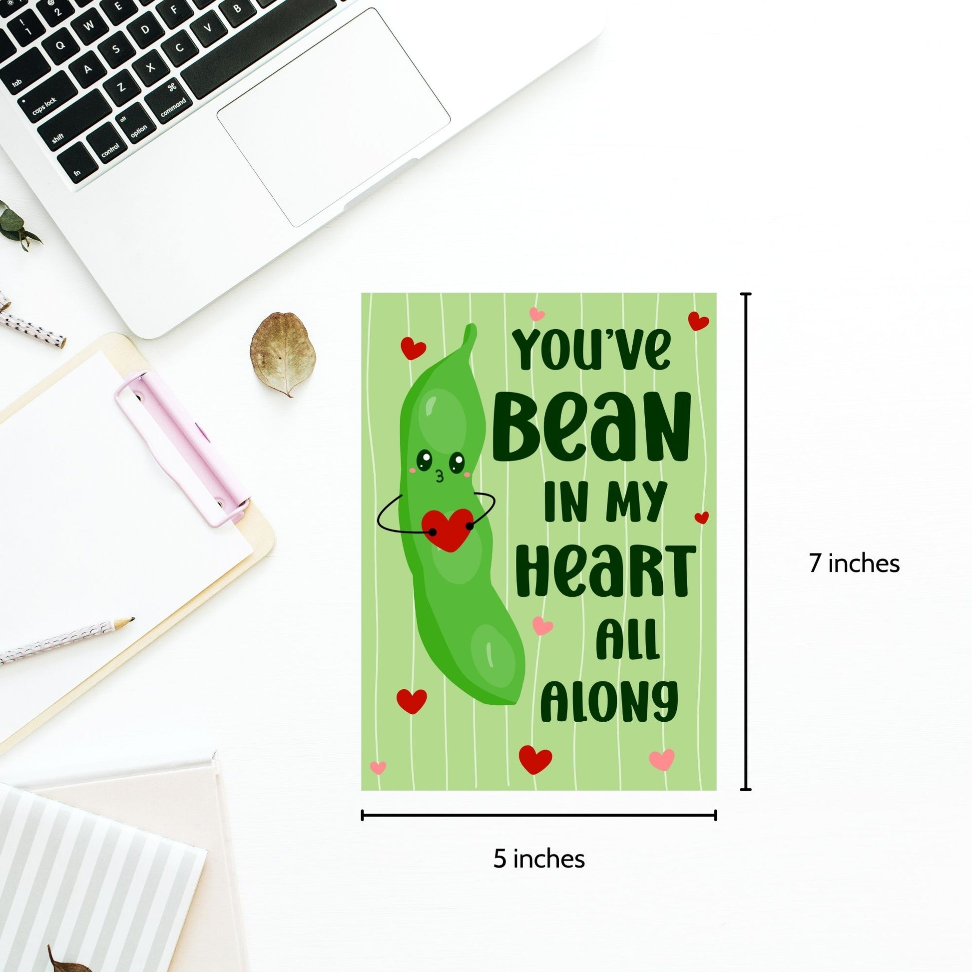 Printable Valentine’s Day Greeting Card featuring the phrase “You’ve Bean in My Heart All Along” with a cute bean design. Designed as a 5x7 PDF on an 8.5 x 11 sheet with two cards per page. A punny and heartfelt Valentine’s card for loved ones.