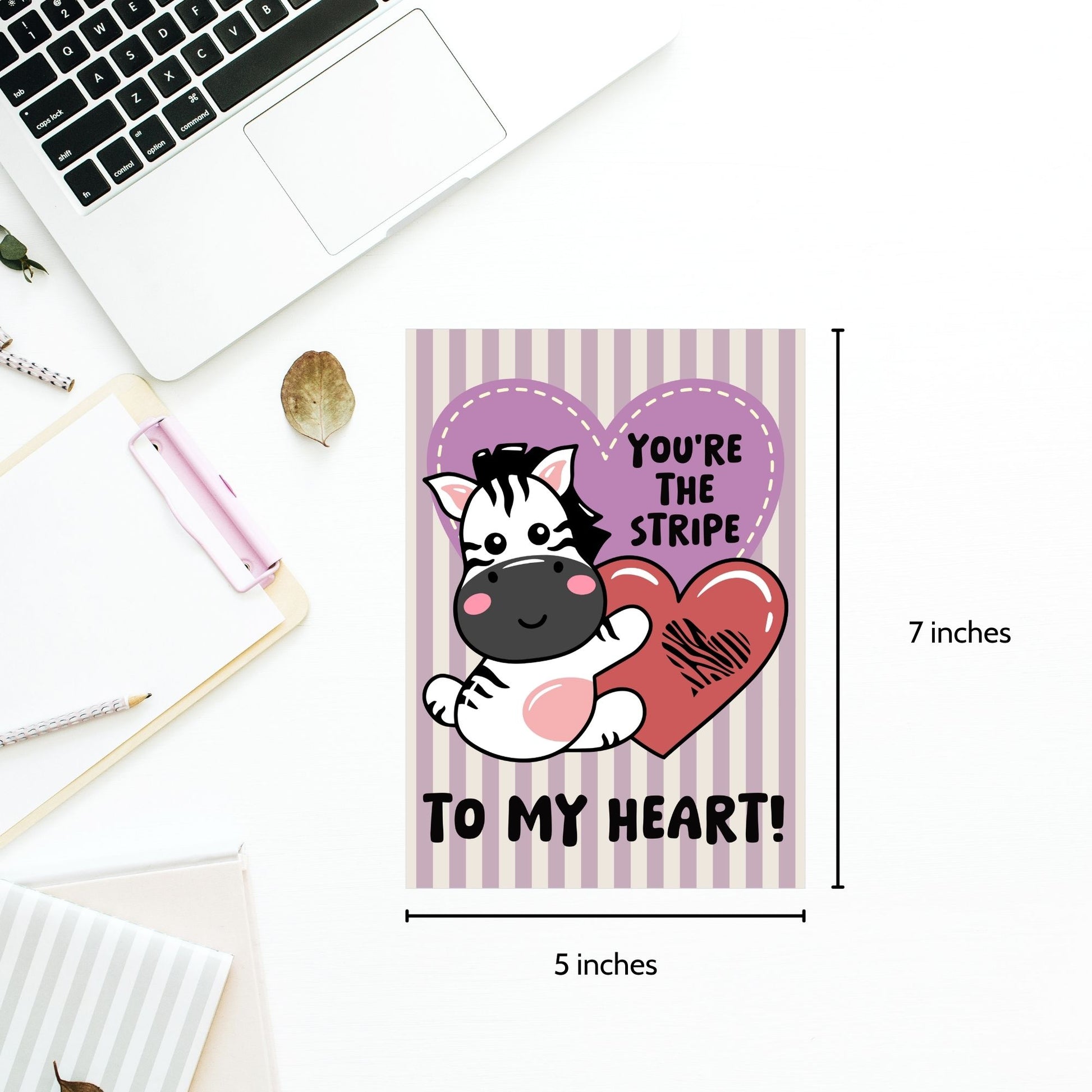 Printable Valentine’s Day Greeting Card featuring the phrase “You’re the Stripe to My Heart” with a zebra design. Designed as a 5x7 PDF on an 8.5 x 11 sheet with two cards per page. A cute and heartfelt Valentine’s card for zebra lovers.